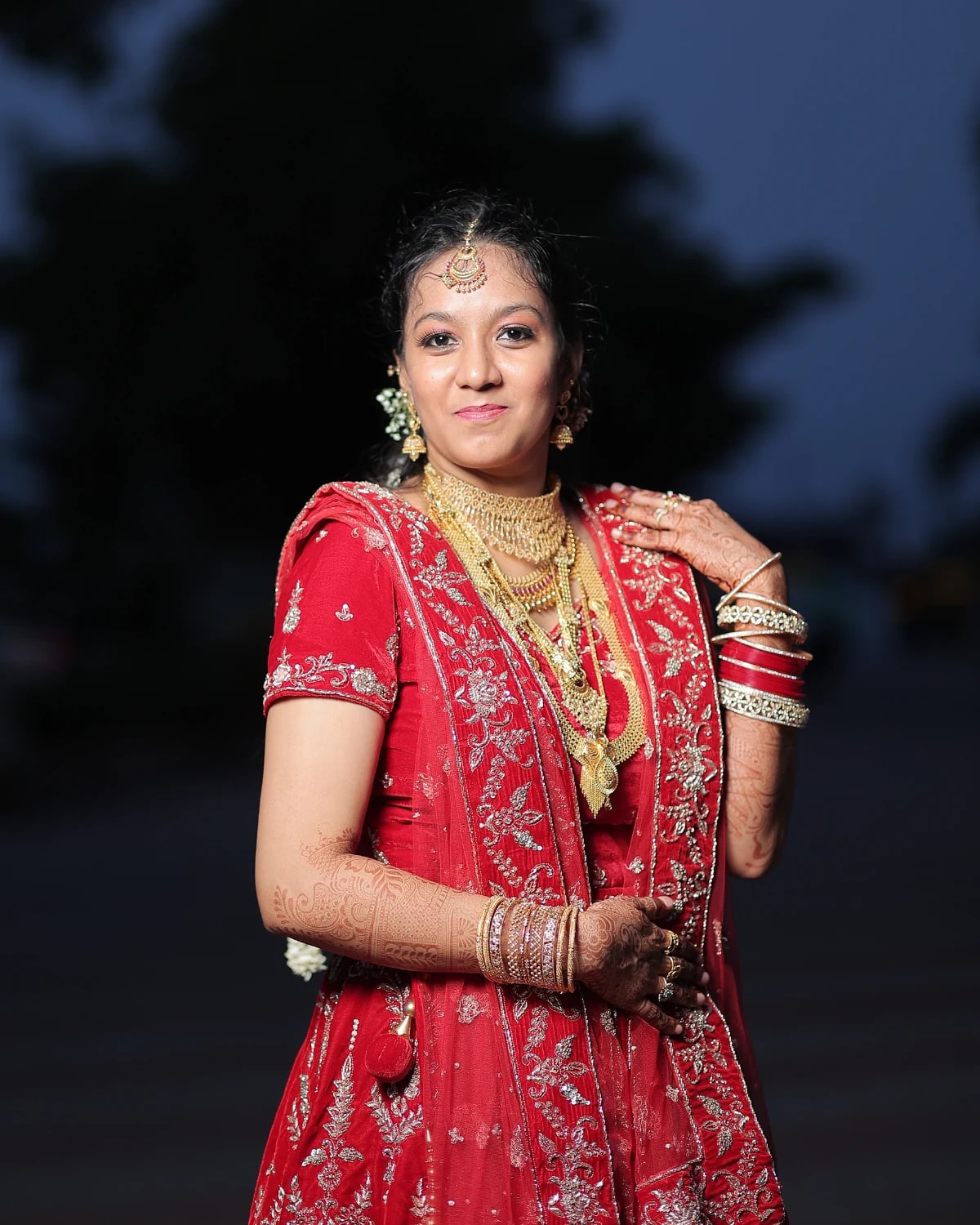 Woman in red standing outdoors