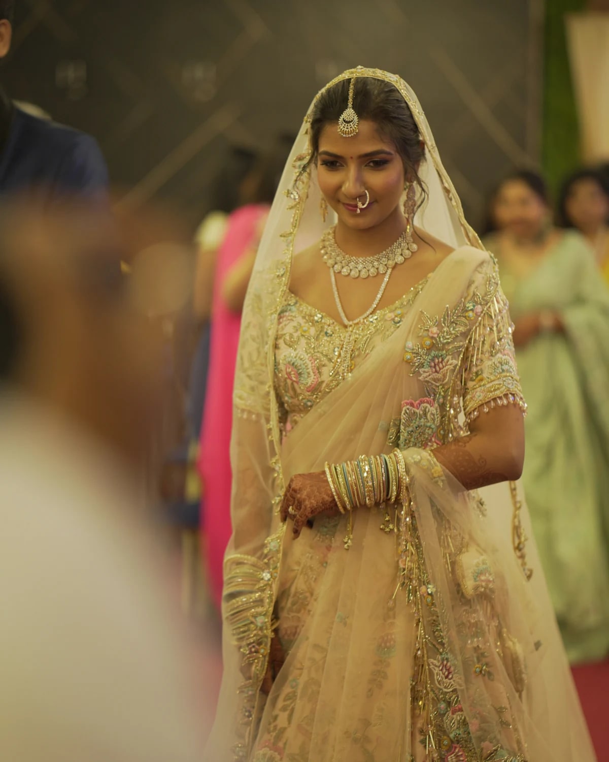 Bride beneath a veil in warm light
